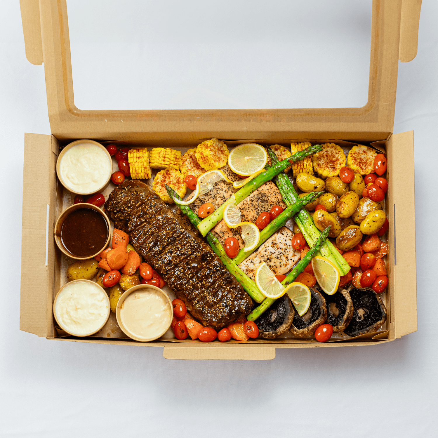 Surf and turf platter with grilled meats and seafood for sharing, ideal for parties in Singapore